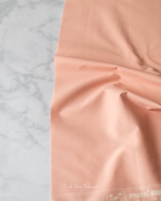 Cotton quilting fabric pattern called 'Blushing'. Part of the 'Pure Solids' fabric collection. Designed by Art Gallery Fabrics for fabric company Art Gallery Fabrics. SKU: PE-505. 44-45 inch width.