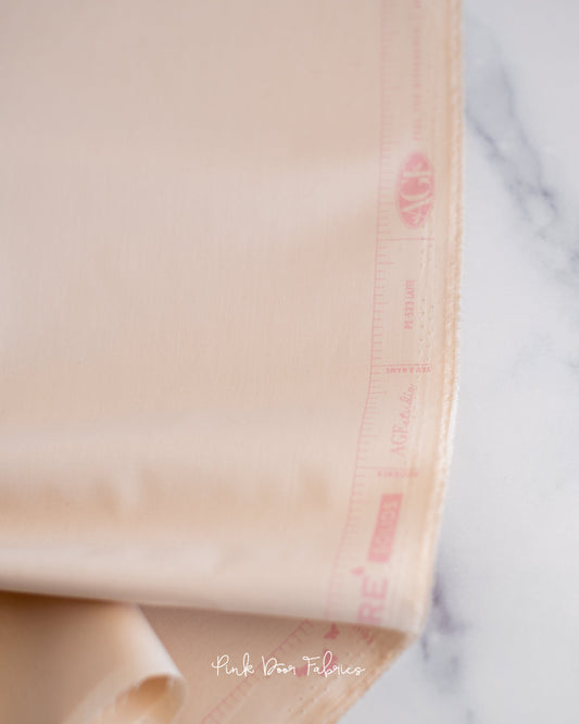 Cotton quilting fabric pattern called 'Latte'. Part of the 'Pure Solids' fabric collection. Designed by Art Gallery Fabrics for fabric company Art Gallery Fabrics. SKU: PE-523. 44-45 inch width.