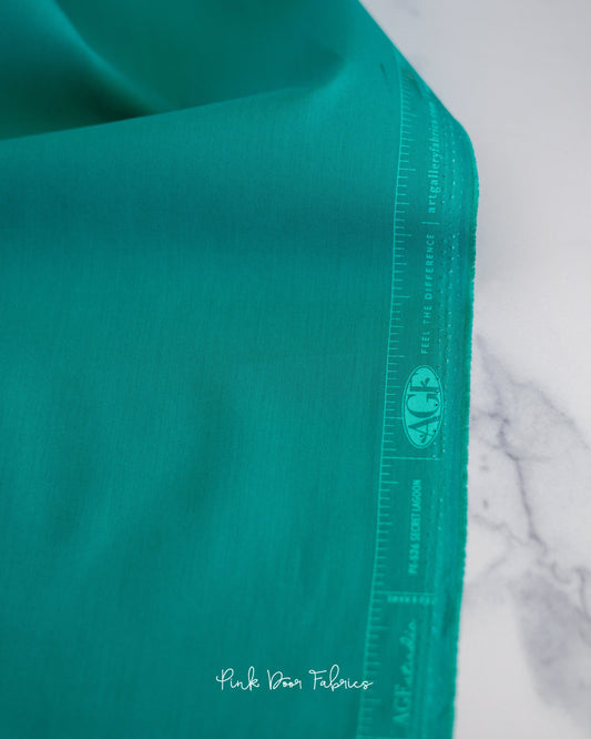 Cotton quilting fabric pattern called 'Secret Lagoon'. Part of the 'Pure Solids' fabric collection. Designed by Art Gallery Fabrics for fabric company Art Gallery Fabrics. SKU: PE-526. 44-45 inch width.