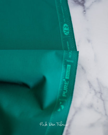 Cotton quilting fabric pattern called 'Peacock'. Part of the 'Pure Solids' fabric collection. Designed by Art Gallery Fabrics for fabric company Art Gallery Fabrics. SKU: PE-527. 44-45 inch width.