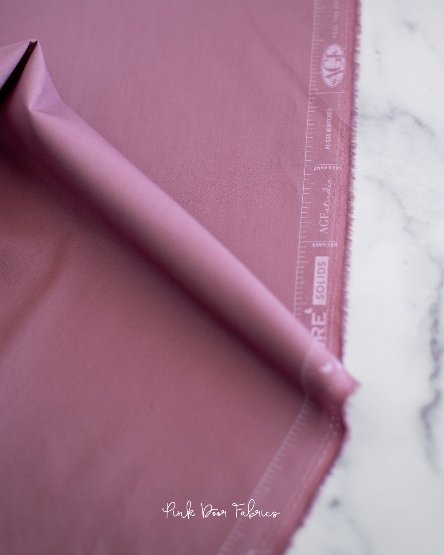 Cotton quilting fabric pattern called 'Bewitched'. Part of the 'Pure Solids' fabric collection. Designed by Art Gallery Fabrics for fabric company Art Gallery Fabrics. SKU: PE-534. 44-45 inch width.