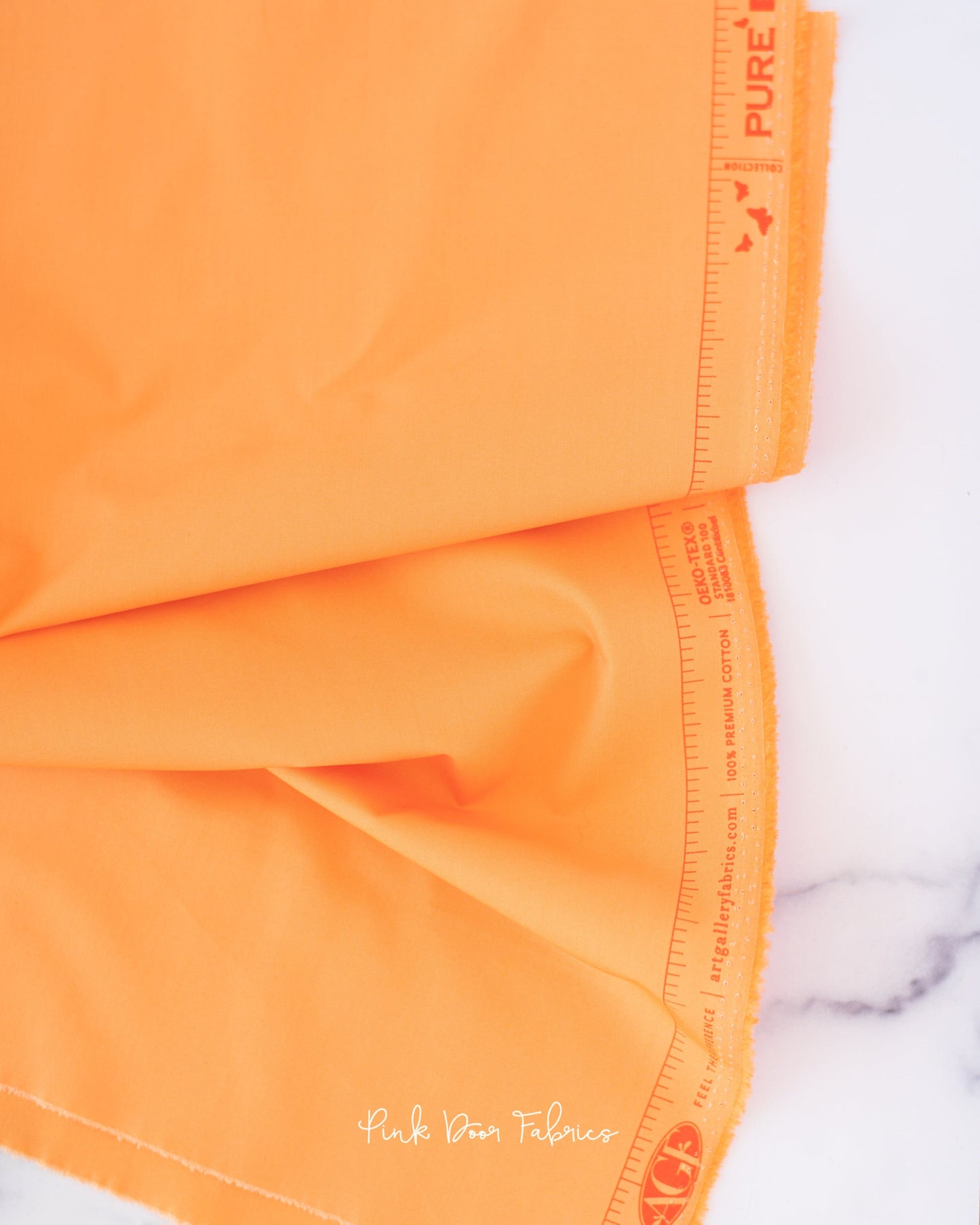 Cotton quilting fabric pattern called 'Marmalade'. Part of the 'Pure Solids' fabric collection. Designed by Art Gallery Fabrics for fabric company Art Gallery Fabrics. SKU: PE-539. 44-45 inch width.