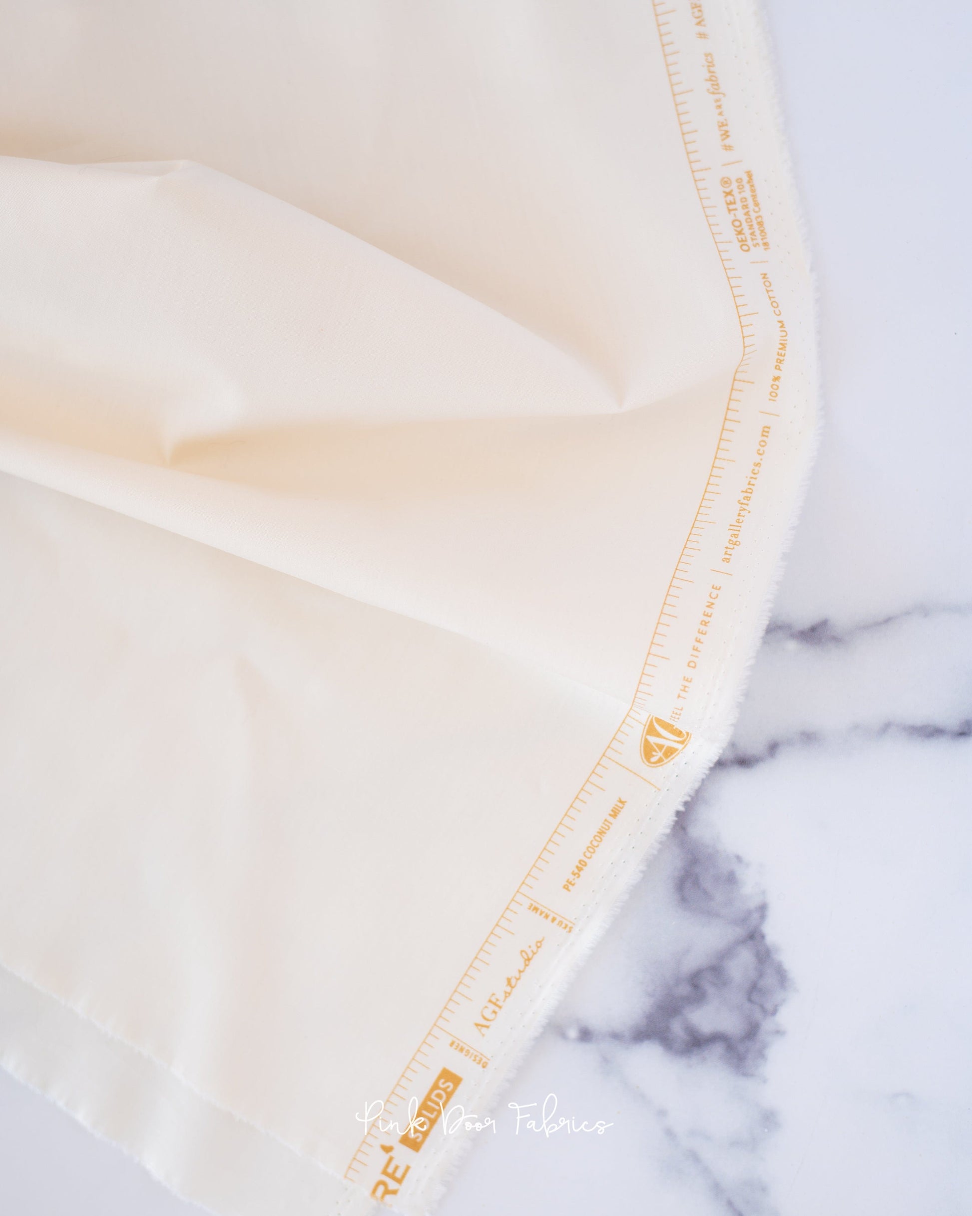 Cotton quilting fabric pattern called 'Coconut Milk'. Part of the 'Pure Solids' fabric collection. Designed by Art Gallery Fabrics for fabric company Art Gallery Fabrics. SKU: PE-540. 44-45 inch width.