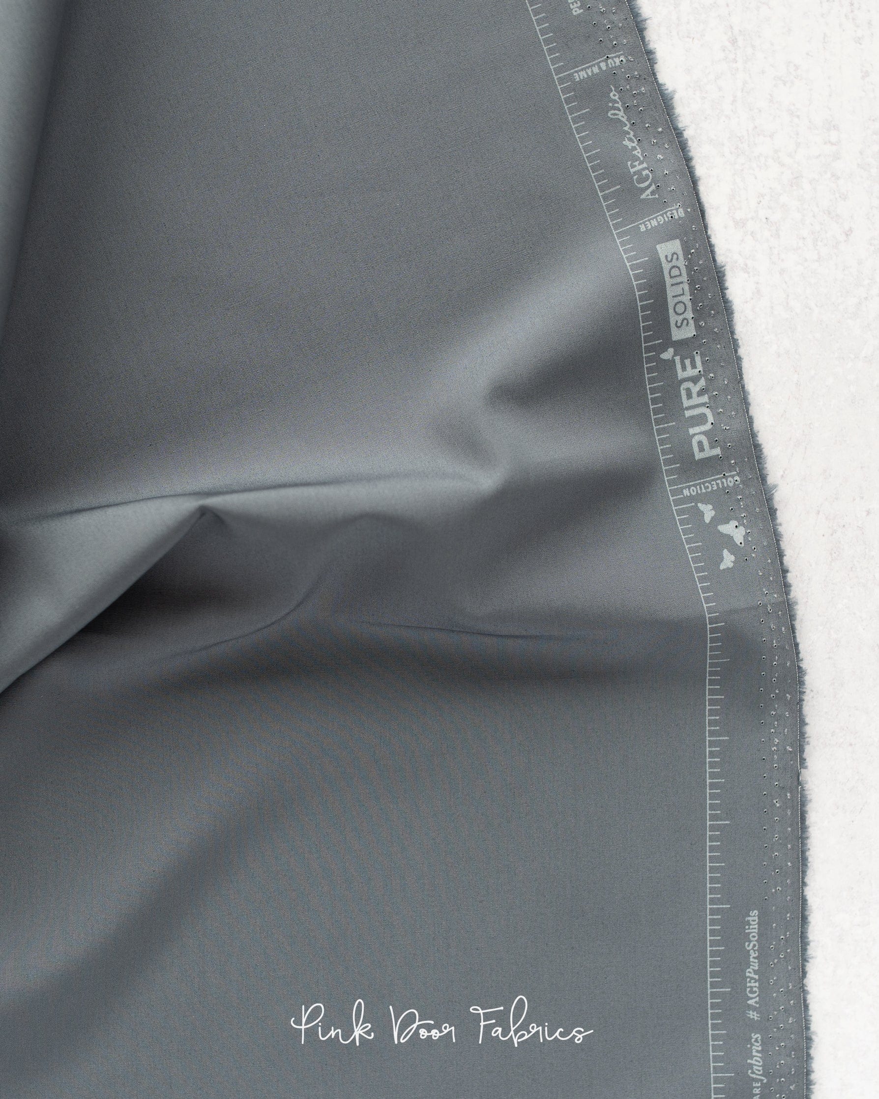 Cotton quilting fabric pattern called 'Slate'. Part of the 'Pure Solids' fabric collection. Designed by Art Gallery Fabrics for fabric company Art Gallery Fabrics. SKU: PE-557. 44-45 inch width.