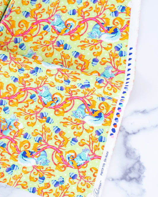 Cotton quilting fabric pattern called 'Oh Nuts! in Glow'. Part of the 'Tiny Beasts' fabric collection. Designed by Tula Pink for fabric company Free Spirit Fabrics. SKU: PWTP179.GLOW. 44-45 inch width.
