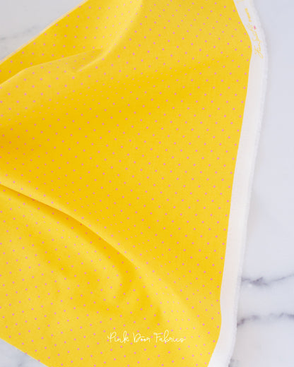 Cotton quilting fabric pattern called 'Tiny Dots in Flare'. Part of the 'True Colors' fabric collection. Designed by Tula Pink for fabric company Free Spirit Fabrics. SKU: PWTP185.FLARE. 44-45 inch width.