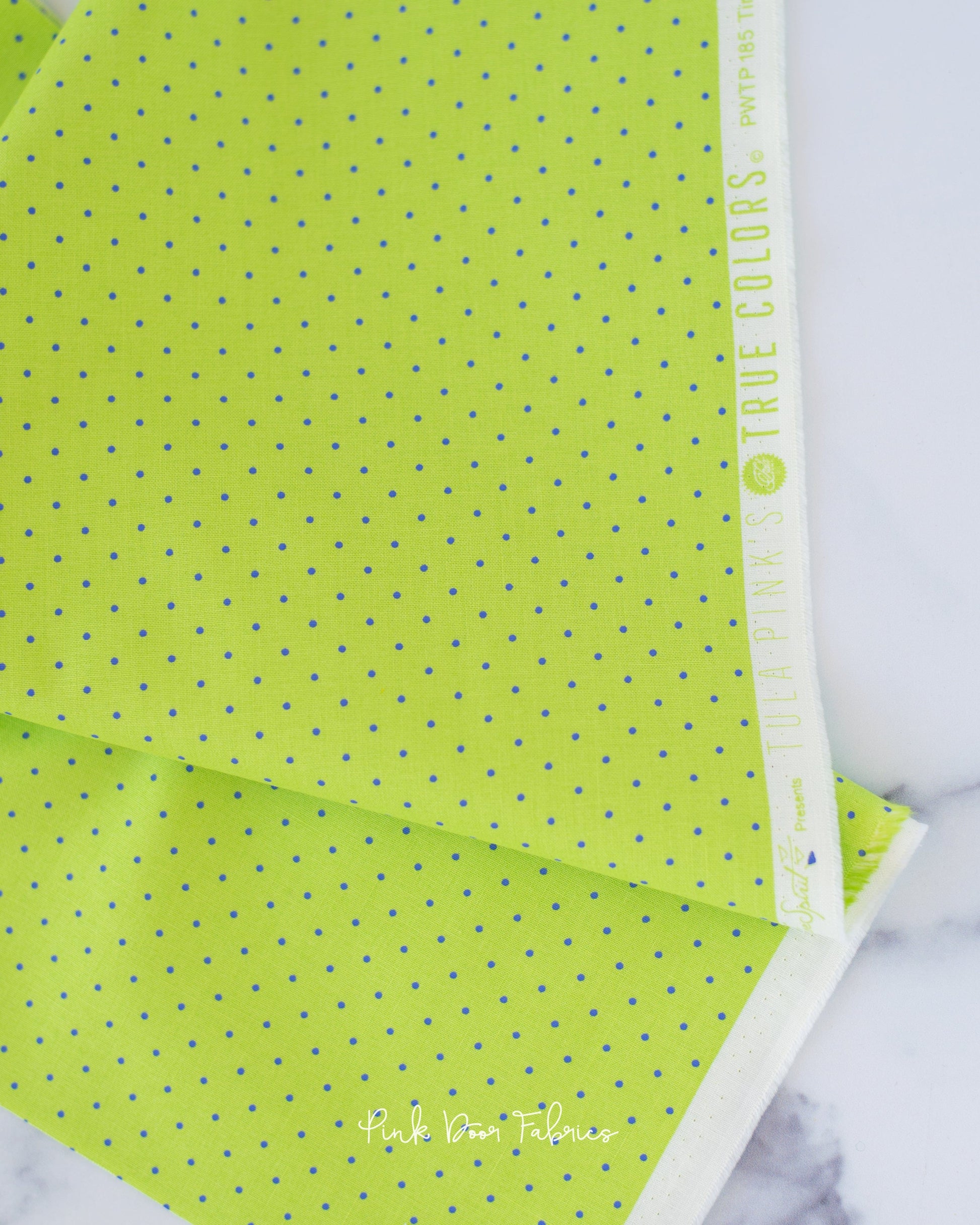 Cotton quilting fabric pattern called 'Tiny Dots in Meadow'. Part of the 'True Colors' fabric collection. Designed by Tula Pink for fabric company Free Spirit Fabrics. SKU: PWTP185.MEADOW. 44-45 inch width.