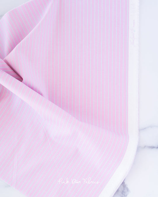 Cotton quilting fabric pattern called 'Tiny Stripes in Petal'. Part of the 'True Colors' fabric collection. Designed by Tula Pink for fabric company Free Spirit Fabrics. SKU: PWTP186.PETAL. 44-45 inch width.