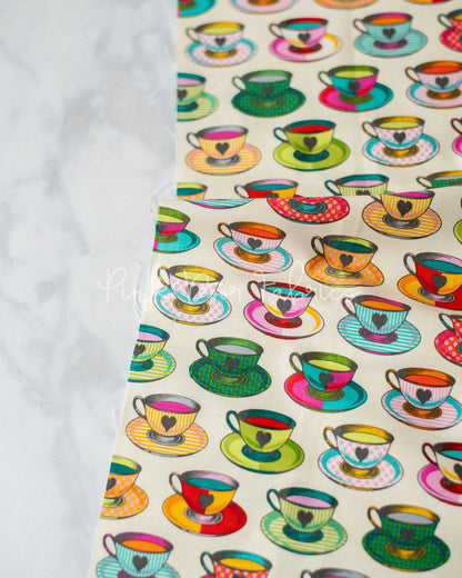 Cotton quilting fabric pattern called 'Tea Time in Sugar'. Part of the 'Curiouser & Curiouser' fabric collection. Designed by Tula Pink for fabric company Free Spirit Fabrics. SKU: PWTP163.SUGAR. 44-45 inch width.