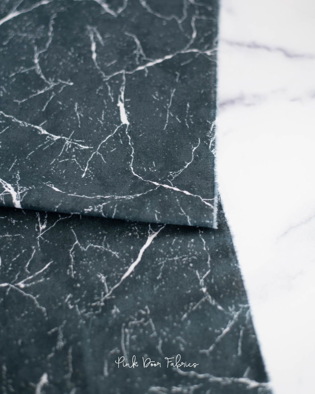 Cotton quilting fabric pattern called 'Pietra in Graphite'. Part of the 'Pietra' fabric collection. Designed by Giucy Giuce for fabric company Andover Fabrics. SKU: A-9881-C1. 44-45 inch width.