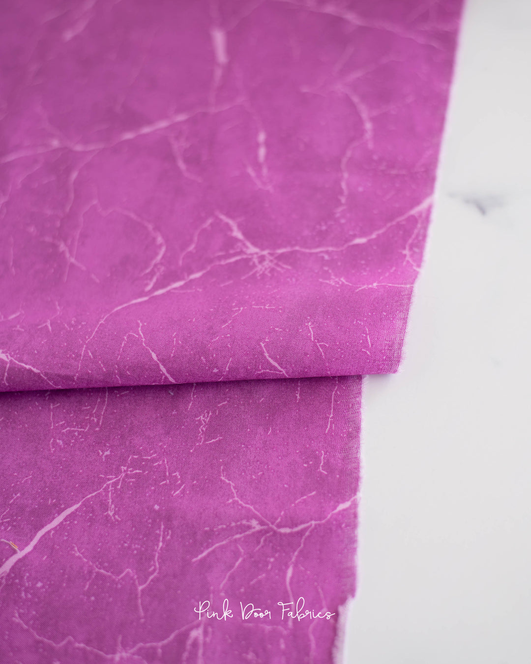 Cotton quilting fabric pattern called 'Pietra in Candy'. Part of the 'Pietra' fabric collection. Designed by Giucy Giuce for fabric company Andover Fabrics. SKU: A-9881-E. 44-45 inch width.