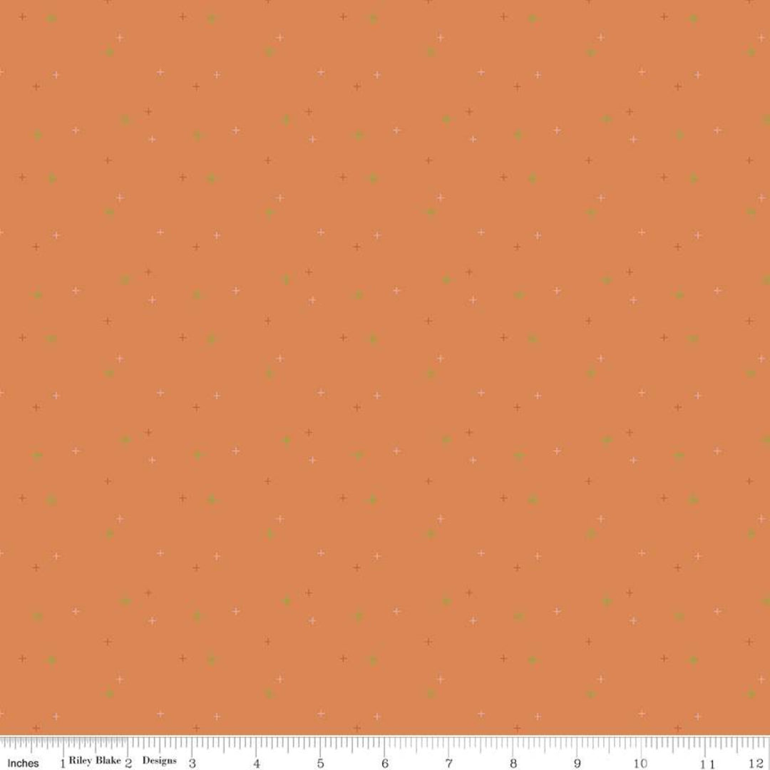 Cotton quilting fabric pattern called 'Sparkler in Pumpkin'. Part of the 'Sparkler' fabric collection. Designed by Melissa Mortenson for fabric company Moda Fabrics. SKU: SC650-PUMPKIN. 44-45 inch width.