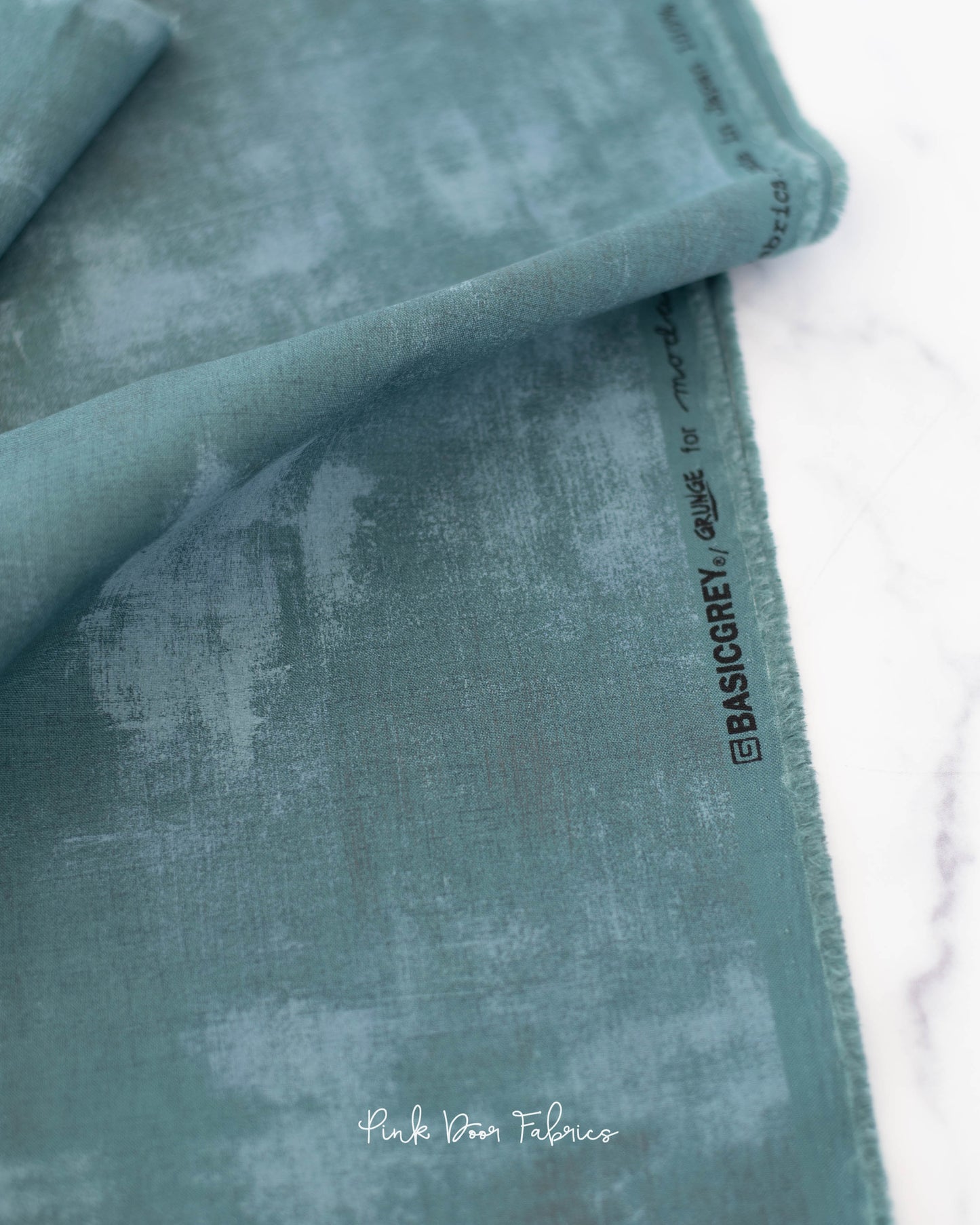 Cotton quilting fabric pattern called 'Deep Teal'. Part of the 'Songbook' fabric collection. Designed by Fancy That Design House and Co. for fabric company Moda Fabrics. SKU: 30150 487. 44-45 inch width.
