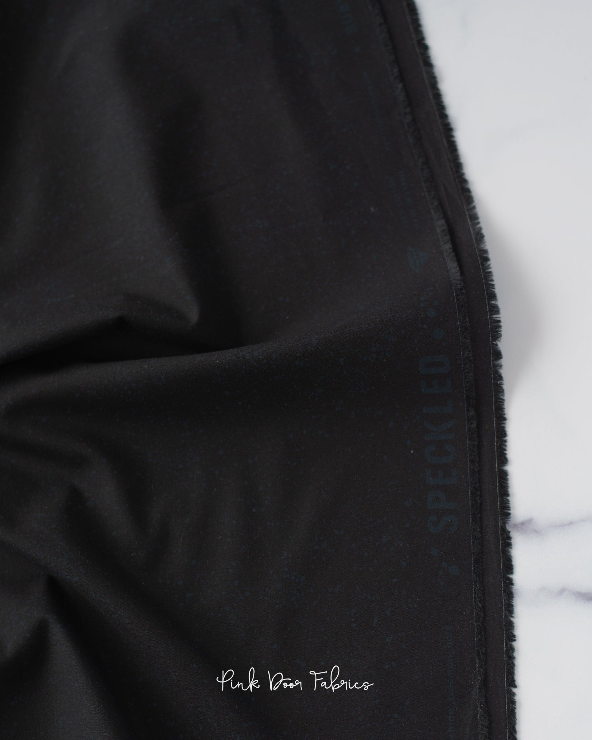 Cotton quilting fabric pattern called 'Onyx'. Part of the 'Speckled Metallic' fabric collection. Designed by Ruby Star Society for fabric company Moda Fabrics. SKU: RS5027 102. 44-45 inch width.