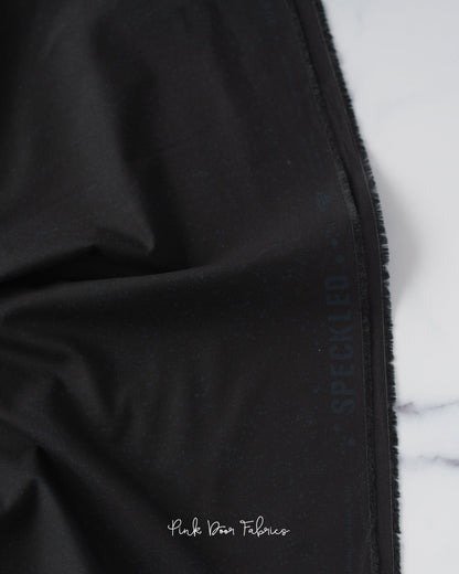 Cotton quilting fabric pattern called 'Onyx'. Part of the 'Speckled Metallic' fabric collection. Designed by Ruby Star Society for fabric company Moda Fabrics. SKU: RS5027 102. 44-45 inch width.