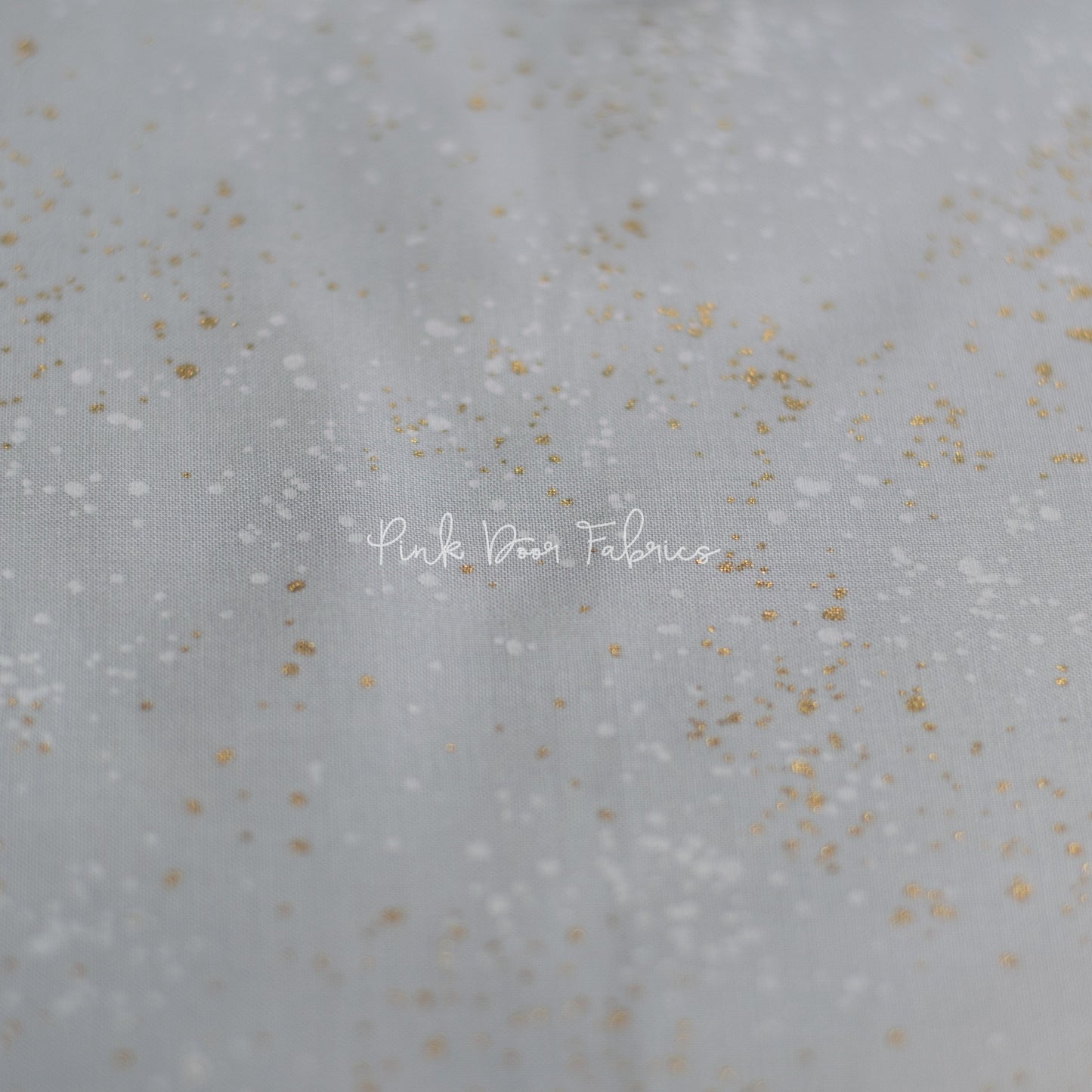 Cotton quilting fabric pattern called 'Dove'. Part of the 'Speckled Metallic' fabric collection. Designed by Ruby Star Society for fabric company Moda Fabrics. SKU: RS5027 59M. 44-45 inch width.