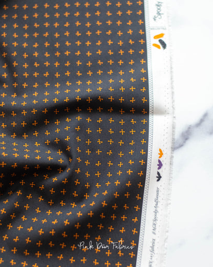 Cotton quilting fabric pattern called 'Crossed Bones in Night'. Part of the 'Spooky 'N Sweeter' fabric collection. Designed by AGF Studio for fabric company Art Gallery Fabrics. SKU: SNS-13016. 44-45 inch width.