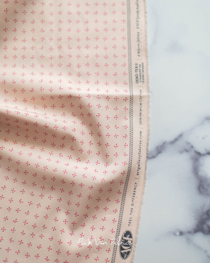 Cotton quilting fabric pattern called 'Crossed Bones in Day'. Part of the 'Spooky 'N Sweeter' fabric collection. Designed by AGF Studio for fabric company Art Gallery Fabrics. SKU: SNS-13022. 44-45 inch width.