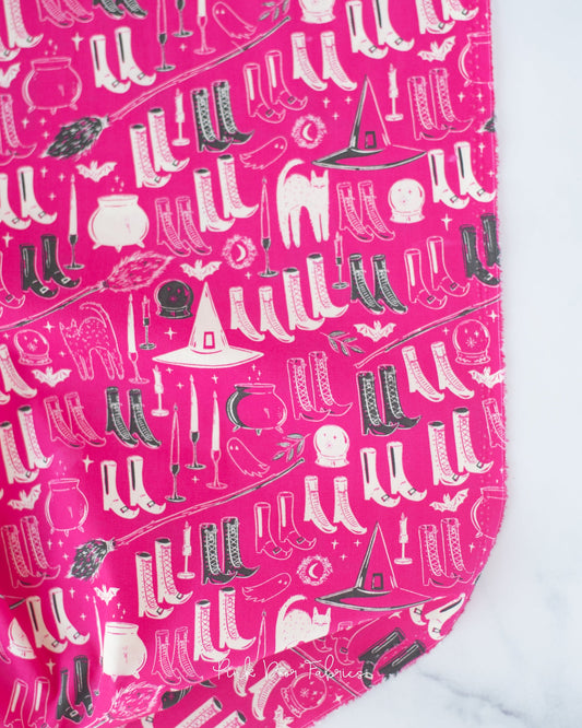 Cotton quilting fabric pattern called 'Witch's Wardrobe in Berry'. Part of the 'Sweet 'N Spookier' fabric collection. Designed by AGF Studio for fabric company Art Gallery Fabrics. SKU: SNS-13037. 44-45 inch width.