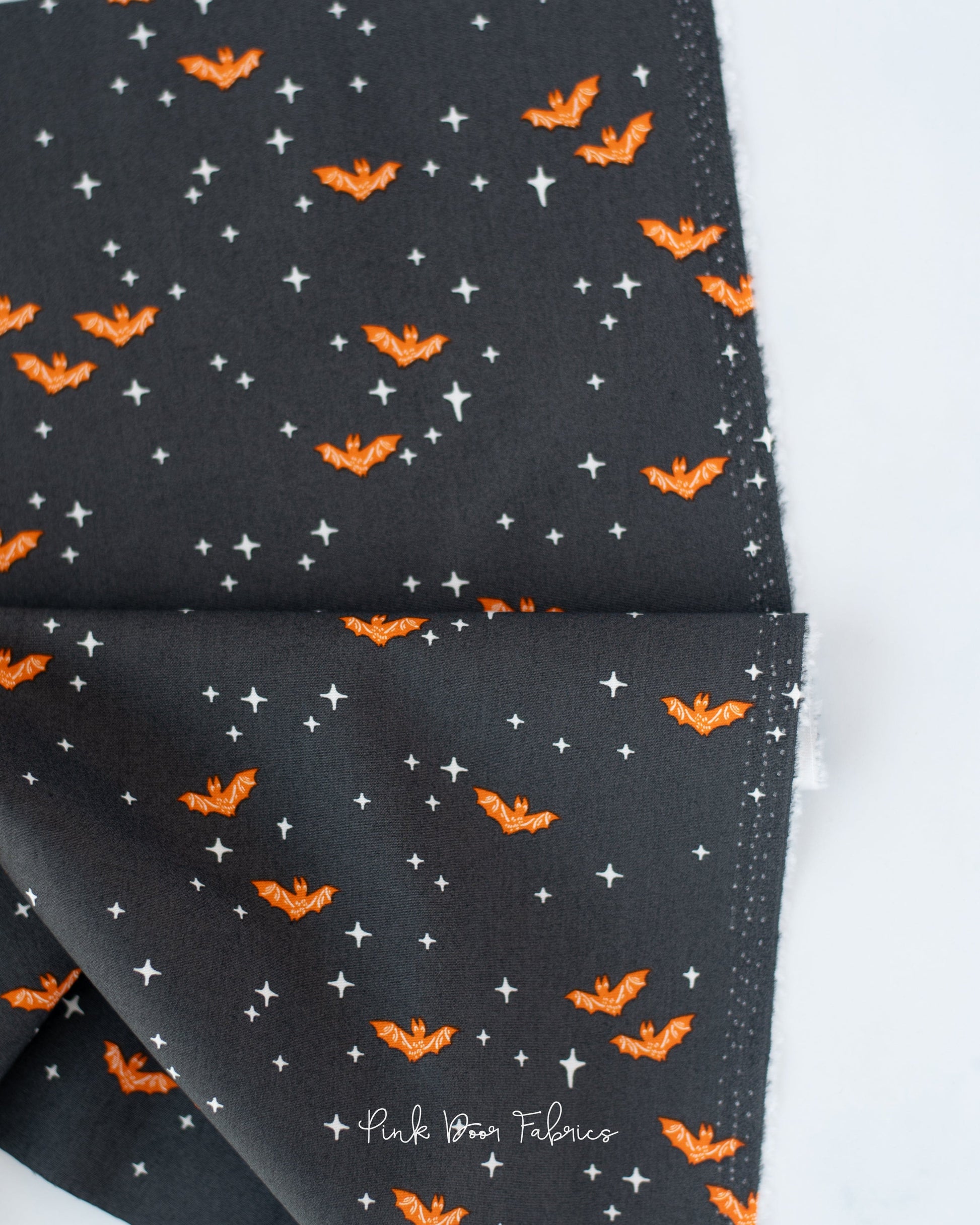 Cotton quilting fabric pattern called 'Winging It in Midnight'. Part of the 'Sweet 'N Spookier' fabric collection. Designed by AGF Studio for fabric company Art Gallery Fabrics. SKU: SNS-13032. 44-45 inch width.