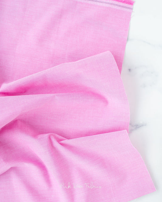 Chambray quilting fabric pattern called 'Cerise'. Part of the 'Chambray Solids' fabric collection. Designed by Tilda Fabrics for the Tilda Fabrics fabric company. SKU: 160013. 44-45 inch width.