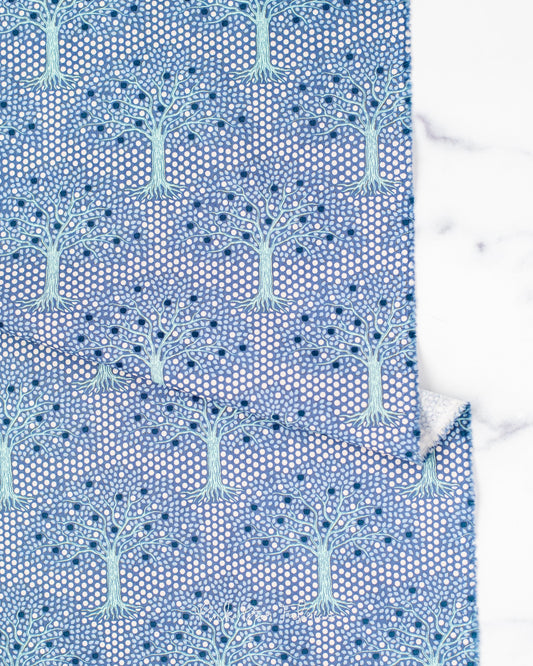 Cotton quilting fabric pattern called 'Applegarden Blue'. Part of the 'Hometown' fabric collection. Designed by Tilda Fabrics for fabric company Tilda Fabrics. SKU: 100468. 44-45 inch width.