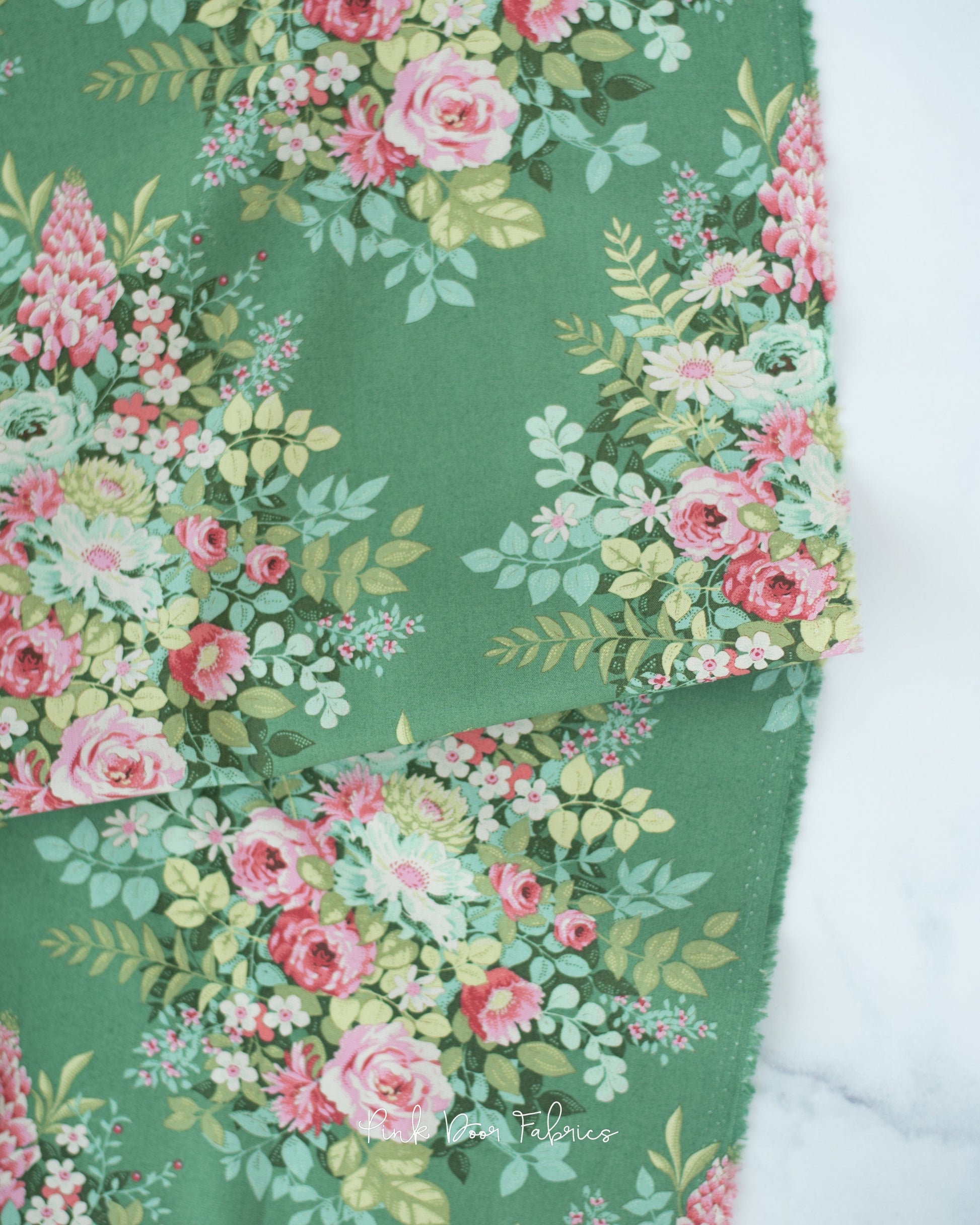 Cotton quilting fabric pattern called 'Whimsyflower in Green'. Part of the 'Chic Escape' fabric collection. Designed by Tilda Fabrics for fabric company Tilda Fabrics. SKU: 100442. 44-45 inch width.