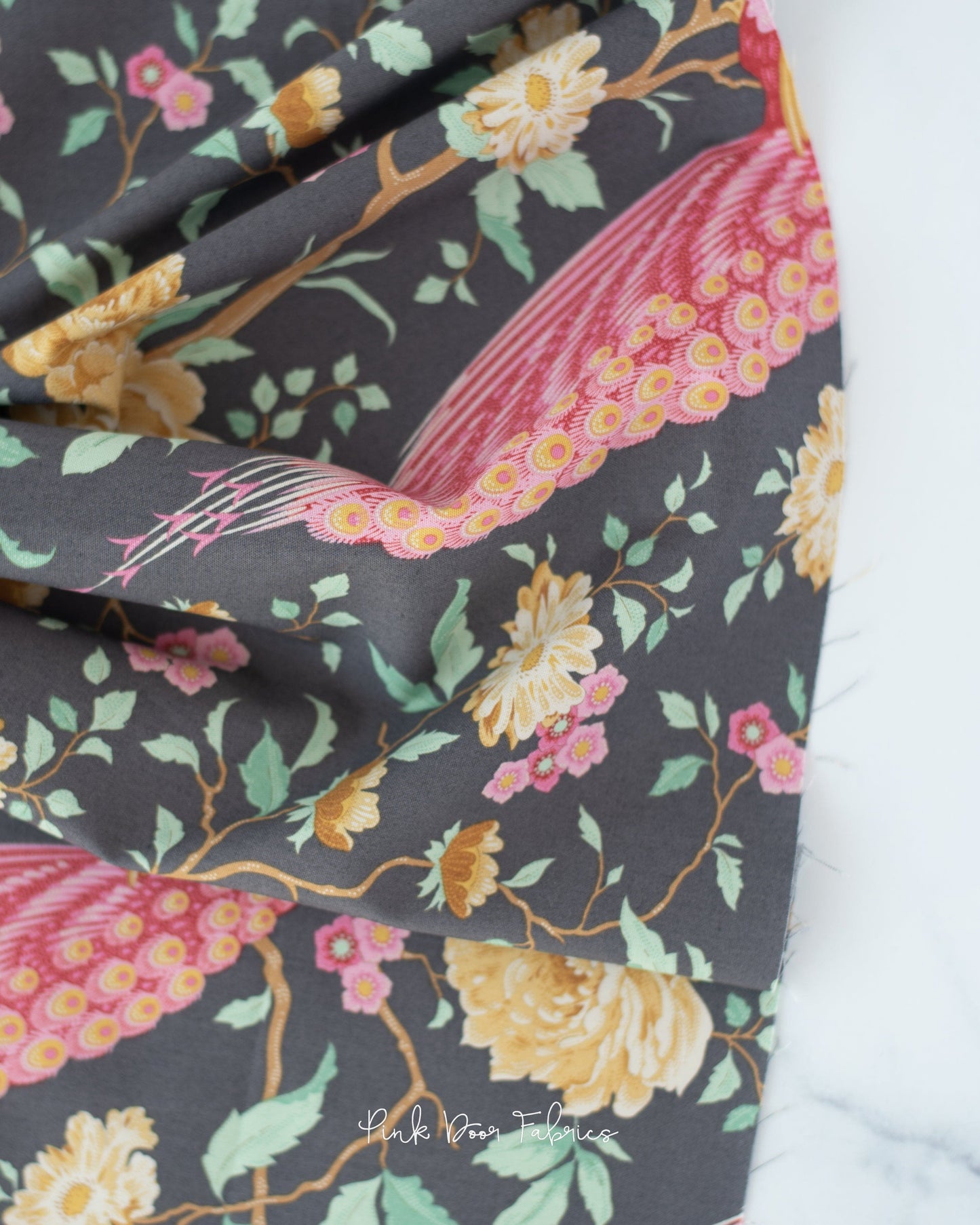 Cotton quilting fabric pattern called 'Peacock Tree in Grey'. Part of the 'Chic Escape' fabric collection. Designed by Tilda Fabrics for fabric company Tilda Fabrics. SKU: 100455. 44-45 inch width.