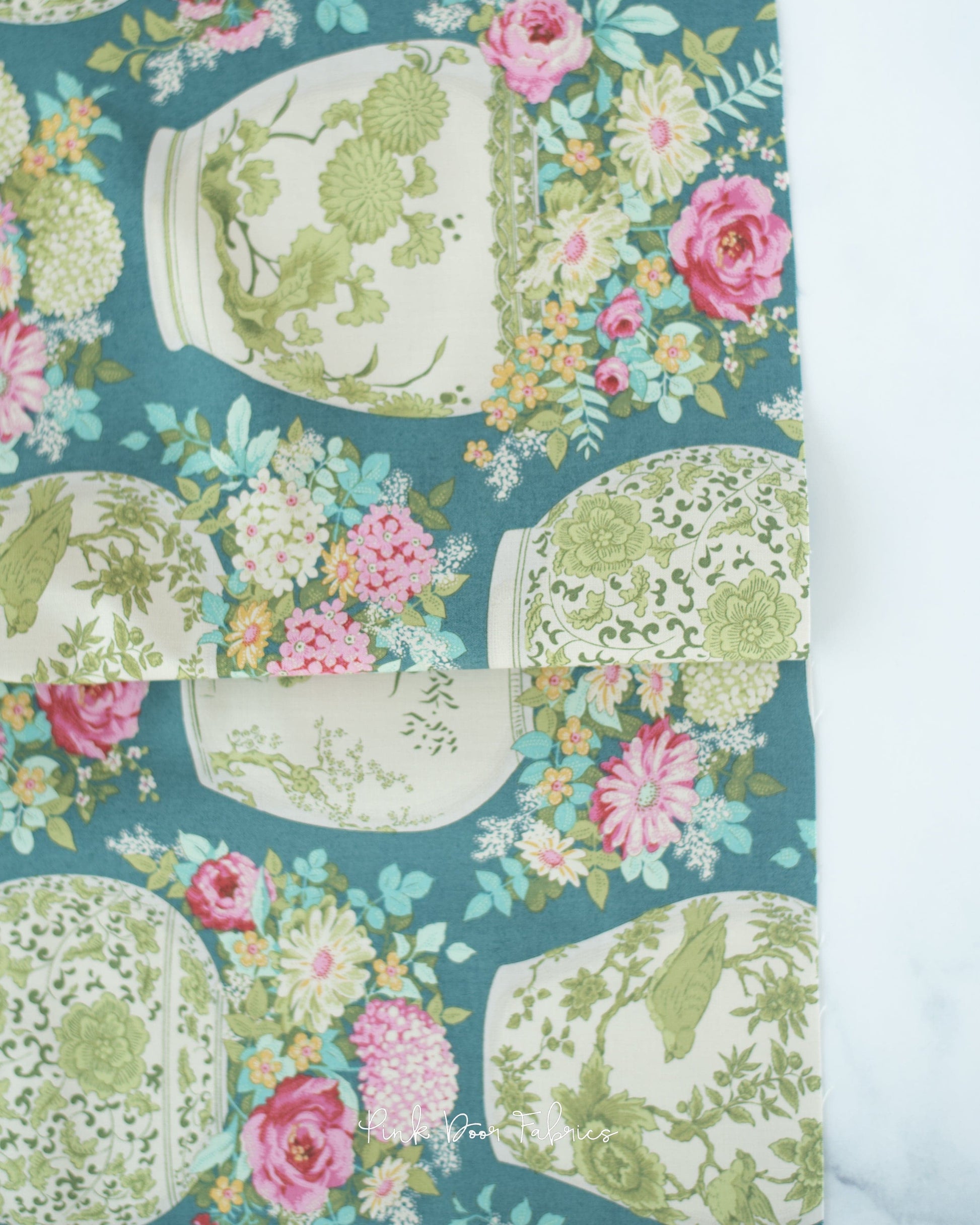Cotton quilting fabric pattern called 'Flowervase in Petrol'. Part of the 'Chic Escape' fabric collection. Designed by Tilda Fabrics for fabric company Tilda Fabrics. SKU: 100443. 44-45 inch width.
