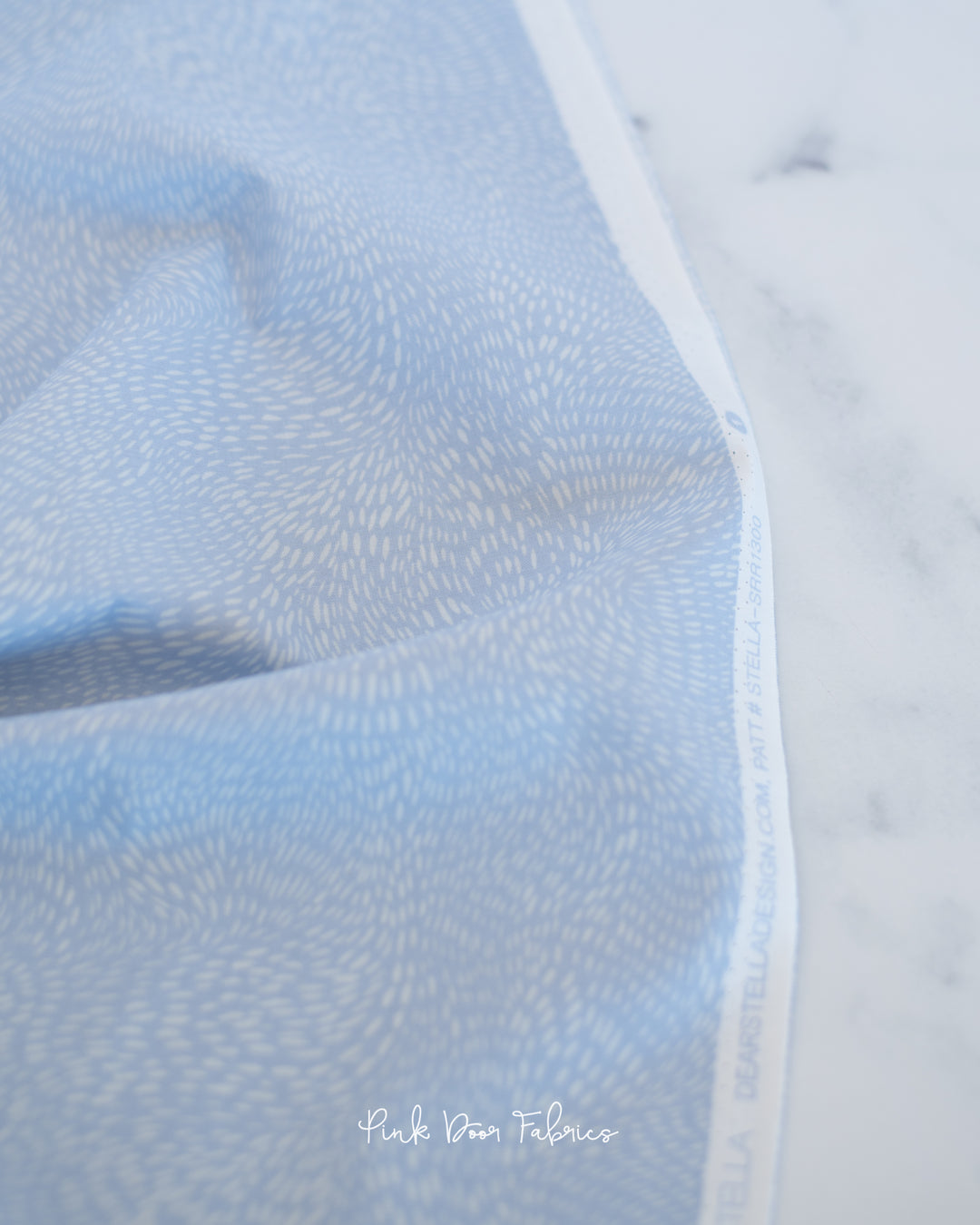 Cotton quilting fabric pattern called 'Dash Flow in Starlight'. Part of the 'Wild Winter' fabric collection. Designed by Rae Ritchie for fabric company Dear Stella Designs. SKU: SRR1300-STAR. 44-45 inch width.